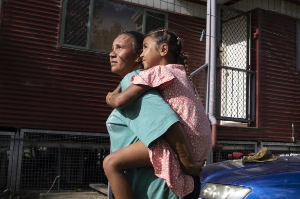 Sharon Duncan at home in Toomelah with her seven-year-old granddaughter Alani McIntosh. 