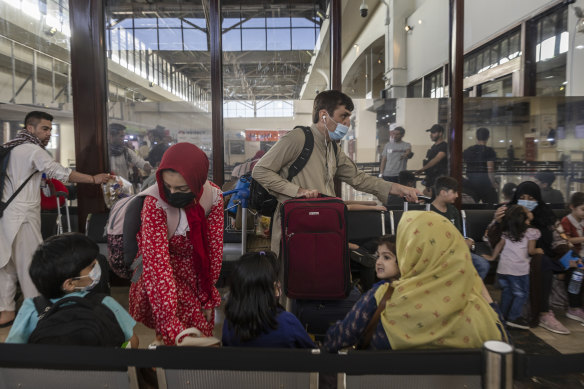 Passengers waiting to board a flight from Kabul’s reopened international airport. 