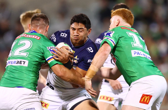 Cowboys forward Jason Taumalolo braces for contact against the Raiders on Thursday night.