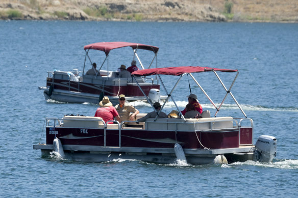 Members of the Ventura County Sheriff's Office are seen in the boats on Monday.