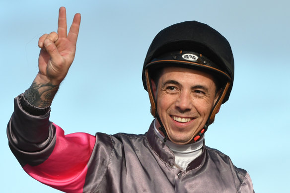 Dean Holland celebrates one of his more than a thousand winners in the saddle.