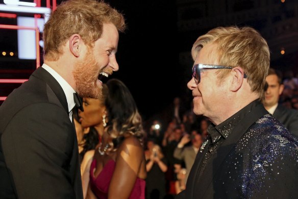 Britain's Prince Harry greets Elton John after the Royal Variety Performance at the Albert Hall in London in 2015.