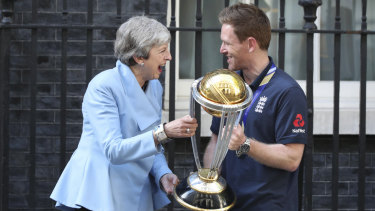 England captain Eoin Morgan shares a laugh with British PM Theresa May.