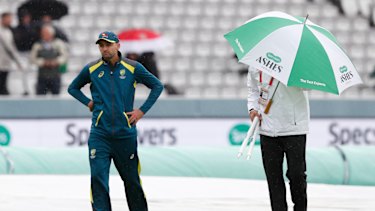 Nathan Lyon walks off the pitch after speaking to the 4th umpire Alex Wharf. 