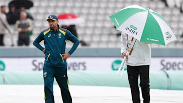 Nathan Lyon walks off the pitch after speaking to the 4th umpire Alex Wharf. 
