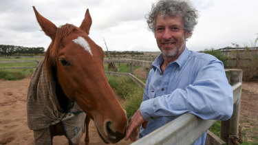 Part-time horse trainer Chris Ryan with his two-year-old filly Bambolina. 