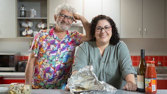 Amy Revell and her dad John Georgiou, who she pays to organise weekly meals for her family.