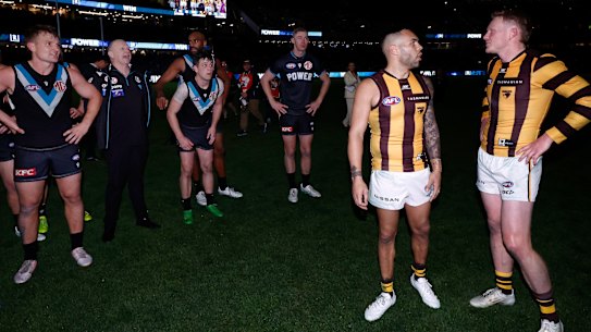 Power coach Ken Hinkley clashes with Hawthorn skipper James Sicily post-match.