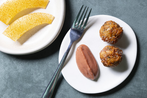 Don’t miss the taro fritters with hot sauce (right).