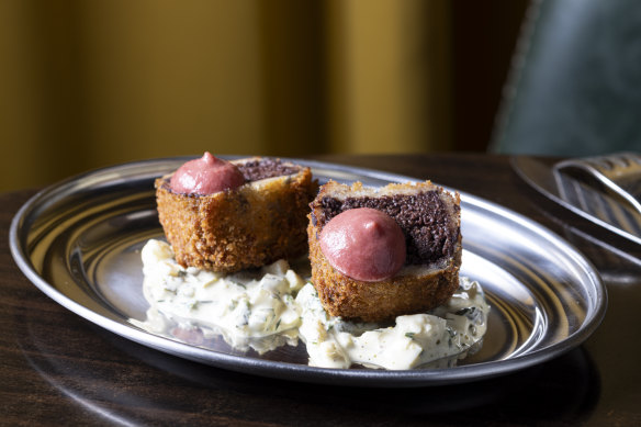 Black pudding croquettes on gribiche sauce.