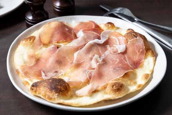 Tuscan covaccino draped with prosciutto.