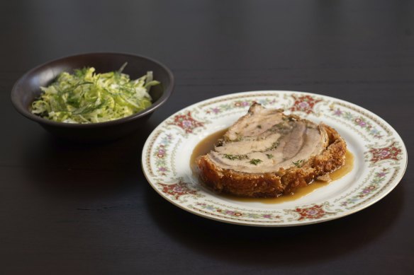 Amber Creek porchetta served with jus and a side salad.