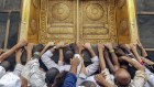 Muslim pilgrims touch the golden door of the Kaaba, Islam's holiest shrine at the Masjidil Haram, Islam's holiest site, ahead of Hajj at the Holy City Of Mecca. 