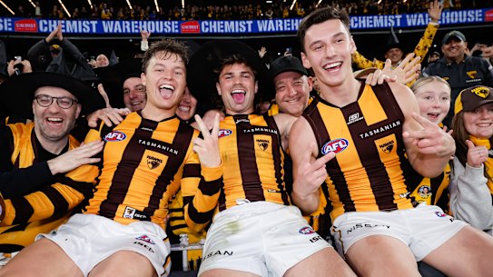 Macdonald celebrates Hawthorn’s win over the Western Bulldogs with Jack Ginnivan (left) and Nick Watson.