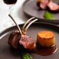 Lamb cutlets with fondant potato and jus.