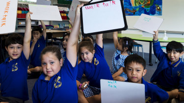 Year 1 students at Oatley Public School use their knowledge of phonics to spell on their whiteboards.
