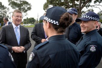 Then premier Denis Napthine at a photo opportunity with police in 2014 to announce the arrival of 1700 new recruits on the beat. 