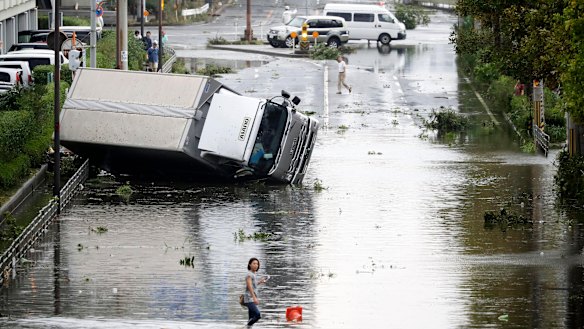 An overturned truck on a flooded road following a powerful typhoon in Osaka, western Japan on September 4.