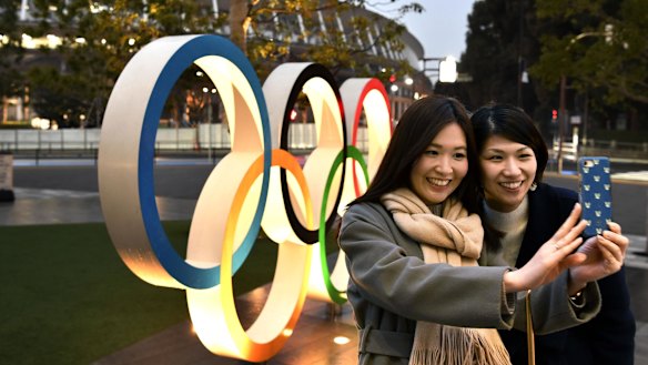A selfie in front of the Tokyo Olympic rings near the new National Stadium in Tokyo.
