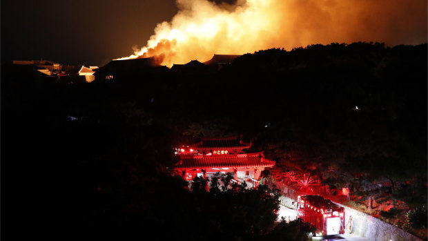 Smoke and flames rise from burning Shuri Castle on Thursday.