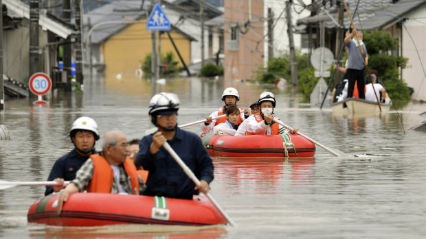 Residents being rescued by boat in Kurashiki, Okayama prefecture.