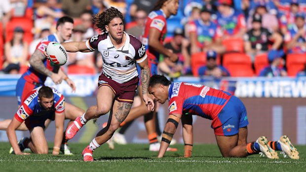 Reece Walsh makes a break for the Broncos.