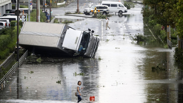 An overturned truck on a flooded road following a powerful typhoon in Osaka, western Japan on September 4.