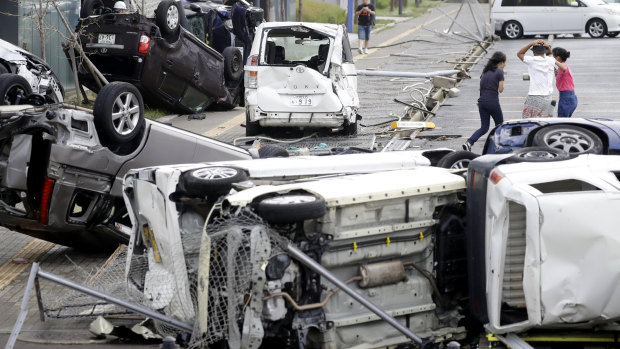 Overturned cars are seen on street following powerful typhoon Jebi in Osaka, western Japan.