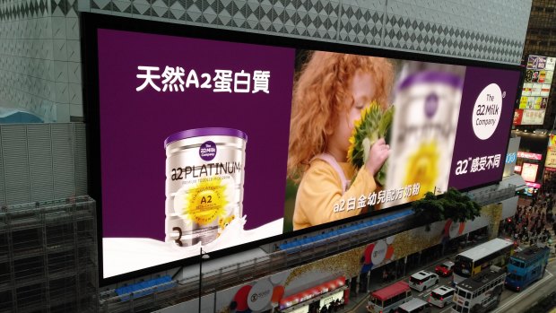 Billboards in Hong Kong advertising a2 infant formula. The company says it will double its marketing spend in China. 