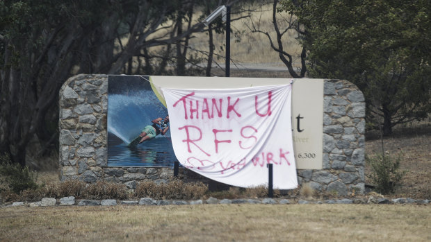 A sign thanking RFS firefighters on the road between Tumut and Batlow after bushfires impacted the Batlow region.