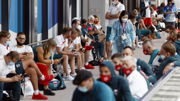 Poland’s team wait for medical tests related to COVID-19 on their arrival for the Tokyo 2020 Olympics. 