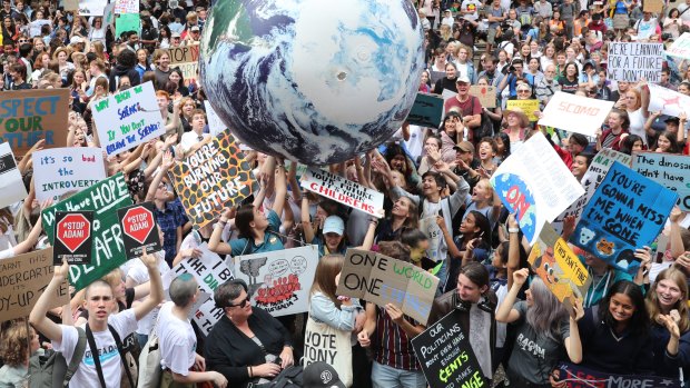 Thousands of school students attend the global climate strike rally at Town Hall in Sydney.
