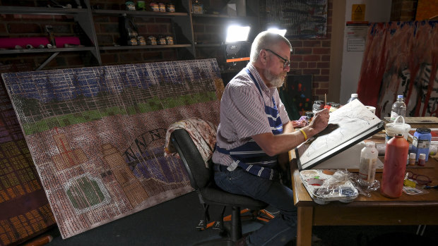 Artist and author the Reverend Glenn Loughrey at his studio in St Oswald's Anglican Church, Glen Iris.
