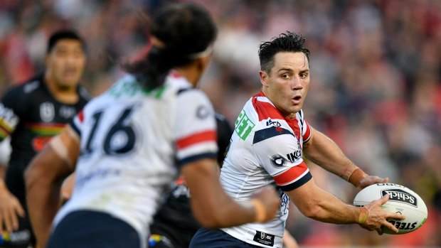 Calling for calm: Roosters halfback Cooper Cronk looks to put Sitili Tupouniua into a hole on Sunday.