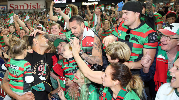 Crowning glory: Sutton with Rabbitohs fans after their 2014 triumph.
