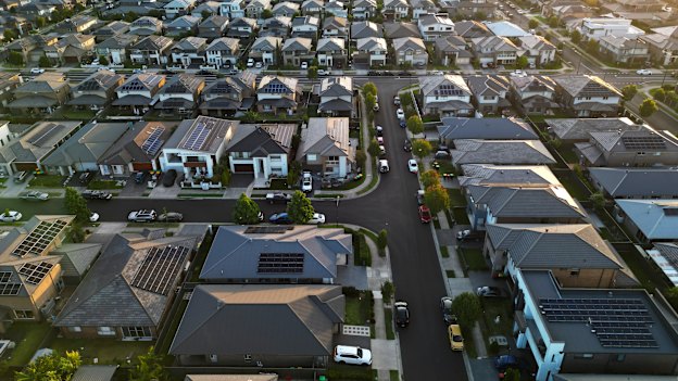 Dark roofs, minimal trees, black roads and driveways are all features of this Marsden Park development.