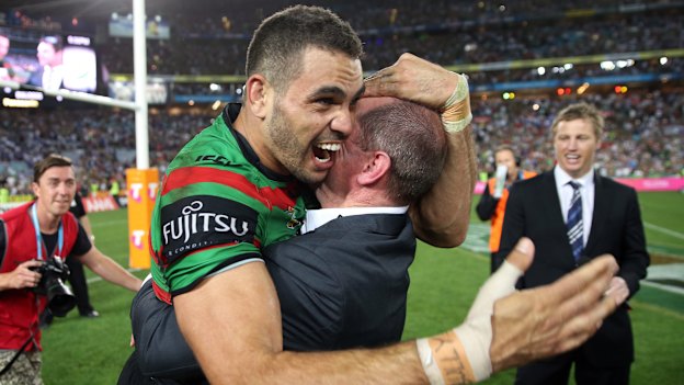Greg Inglis and Michael Maguire share a moment after South Sydney’s 2014 grand final triumph.