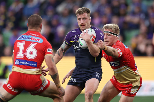 Storm star Cameron Munster runs the ball against the Dolphins at AAMI Park.