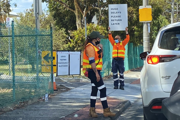 Signs at a Heidelberg testing site telling people to return later.