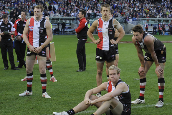 Disappointed St Kilda players in 2009, including Brendon Goddard (left).