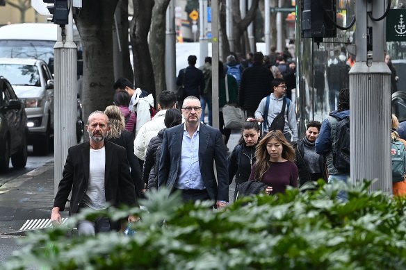 Jon Waldron, second from left, outside the Downing Centre District Court on Wednesday.