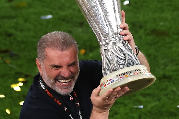 Ange Postecoglou, Manager of Tottenham Hotspur, lifts the UEFA Europa League title.