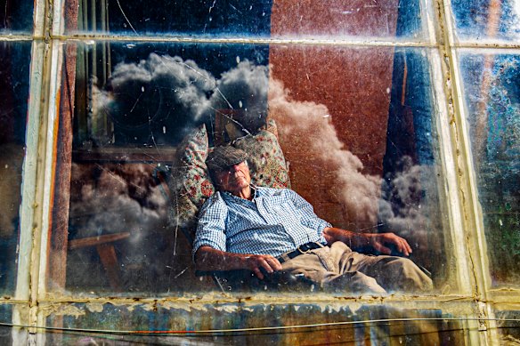 Keith Bradshaw soaking up the afternoon sun in his off-grid house in McKillops Bridge.