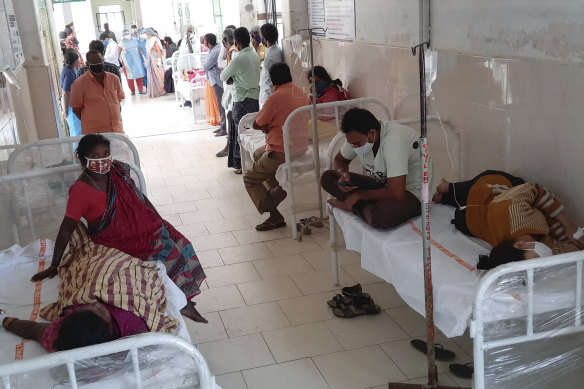 Patients at a hospital in Eluru, where more than 200 people have fallen ill with the mystery illness.