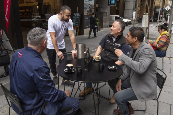 Customers having coffee in a former loading zone outside Soho Espresso on Pitt St in the Sydney CBD.