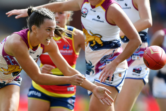 Jade Ellenger of Brisbane handballs during her side’s grand final win over Adelaide last month.