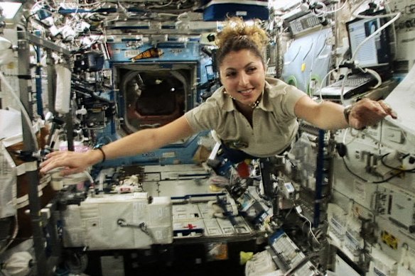 Astronaut Anousheh Ansari floats through the International Space Station.