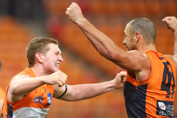 Tom Green and Shane Mumford celebrate the resurgent Giants' defeat of Collingwood on Friday night.