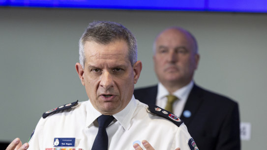 RFS Commissioner Rob Rogers, with Emergency Services Minister David Elliott in the background, as a media event last year.