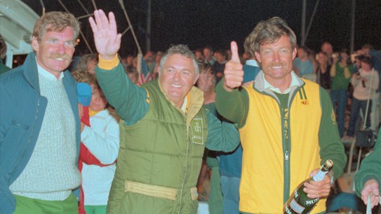 Alan Bond and John Bertrand celebrate victory in Newport on September 26, 1983.